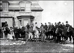 b&w image of people on horseback